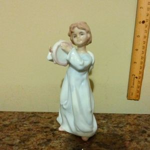 Vintage Angel playing the tambourine